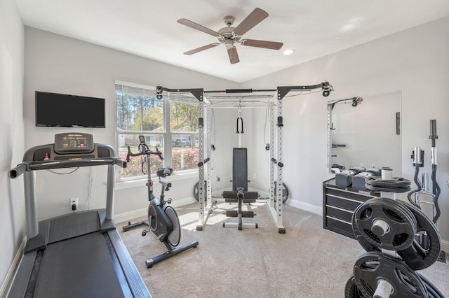 workout room featuring carpet flooring, baseboards, a ceiling fan, and vaulted ceiling
