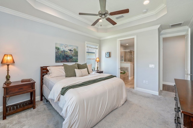 bedroom featuring visible vents, a raised ceiling, light colored carpet, and baseboards