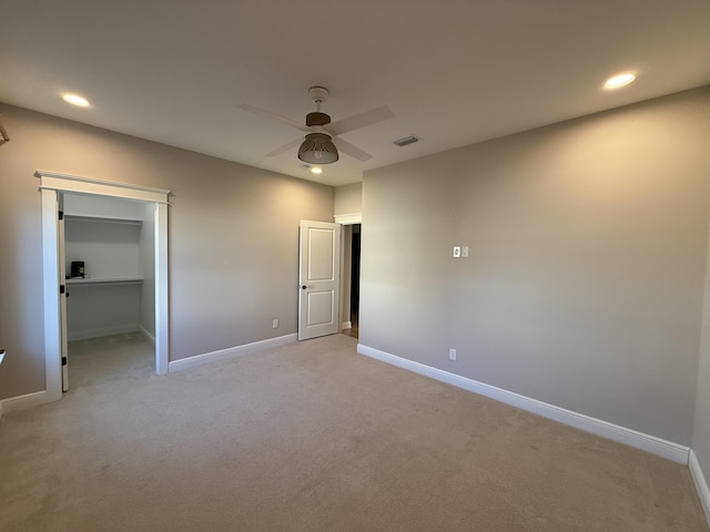 unfurnished bedroom with visible vents, recessed lighting, baseboards, light colored carpet, and ceiling fan