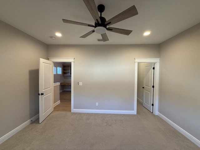unfurnished bedroom with recessed lighting, baseboards, light colored carpet, and a ceiling fan