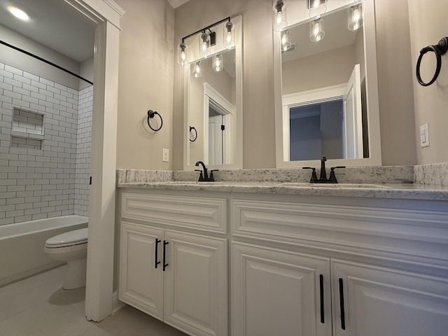 full bath featuring double vanity, washtub / shower combination, toilet, and a sink