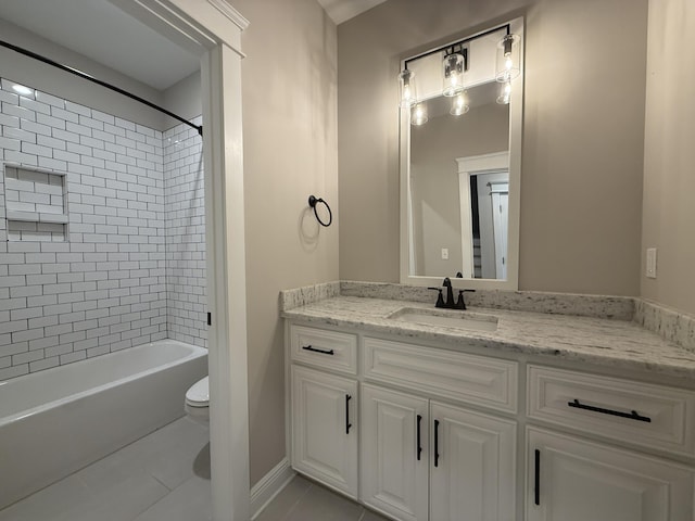 bathroom featuring shower / bathing tub combination, toilet, vanity, and tile patterned flooring