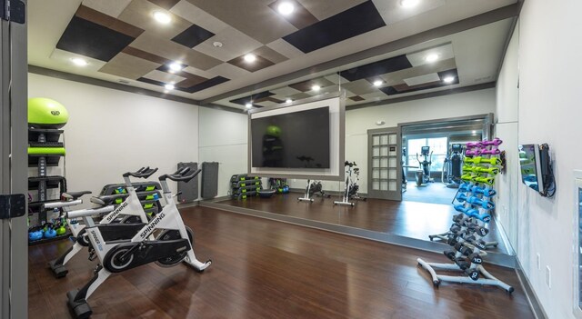gym with wood finished floors