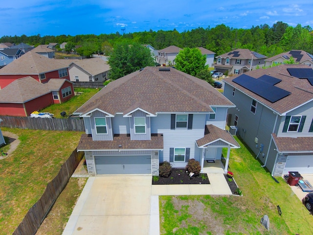 birds eye view of property with a residential view
