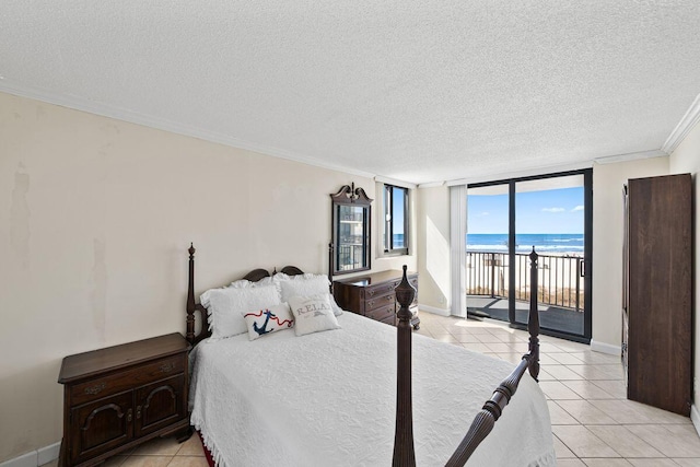 9850 S Thomas Dr Unit 205W, Panama City Beach, FL 32408 - bedroom with light tile patterned floors, a textured ceiling, access to exterior, and crown molding