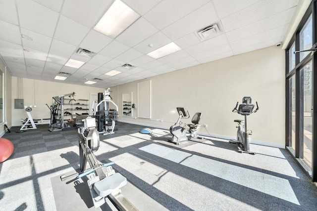 9850 S Thomas Dr Unit 205W, Panama City Beach, FL 32408 - exercise room featuring visible vents, a paneled ceiling, and baseboards