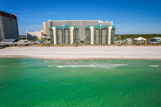 9850 S Thomas Dr Unit 205W, Panama City Beach, FL 32408 - drone / aerial view featuring a water view and a view of the beach