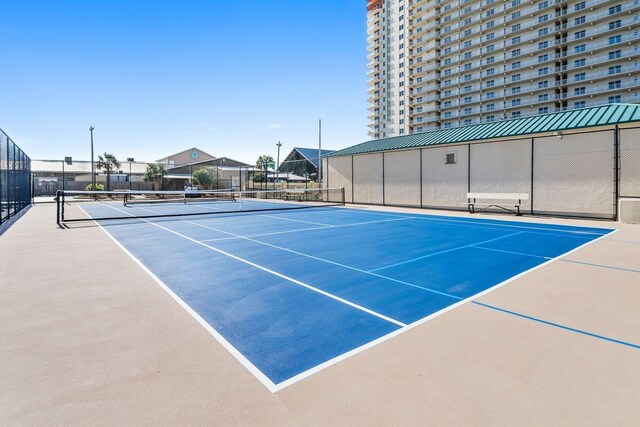 9850 S Thomas Dr Unit 205W, Panama City Beach, FL 32408 - view of sport court featuring fence