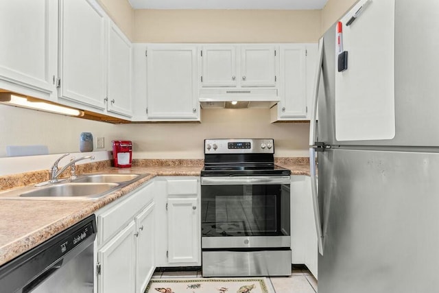kitchen with a sink, stainless steel appliances, light countertops, white cabinets, and under cabinet range hood