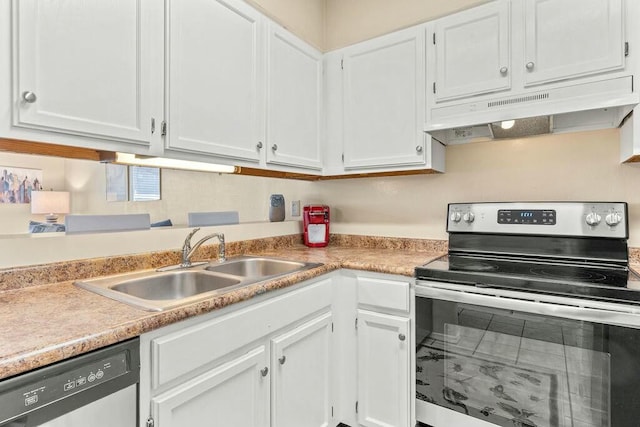 kitchen with under cabinet range hood, appliances with stainless steel finishes, white cabinets, and a sink