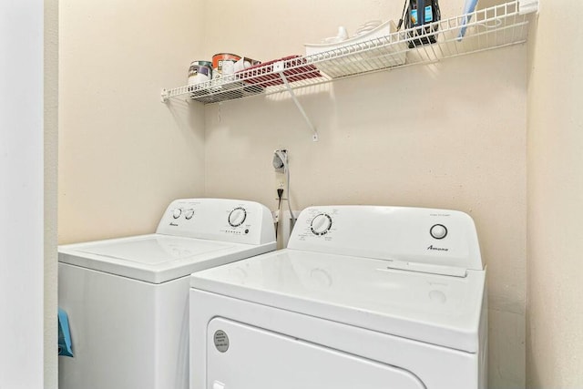 laundry area featuring laundry area and washing machine and dryer
