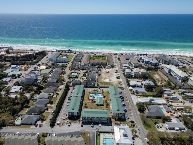 birds eye view of property featuring a view of the beach and a water view