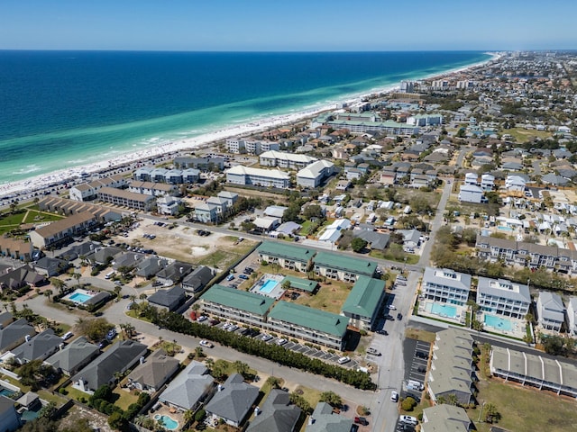 drone / aerial view with a water view and a view of the beach