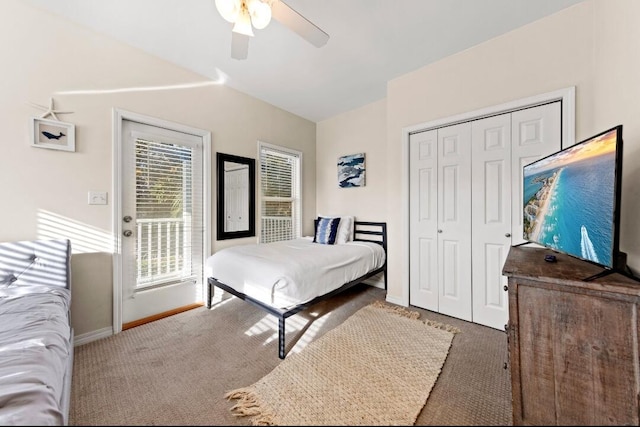 carpeted bedroom with baseboards, a ceiling fan, a closet, and access to outside