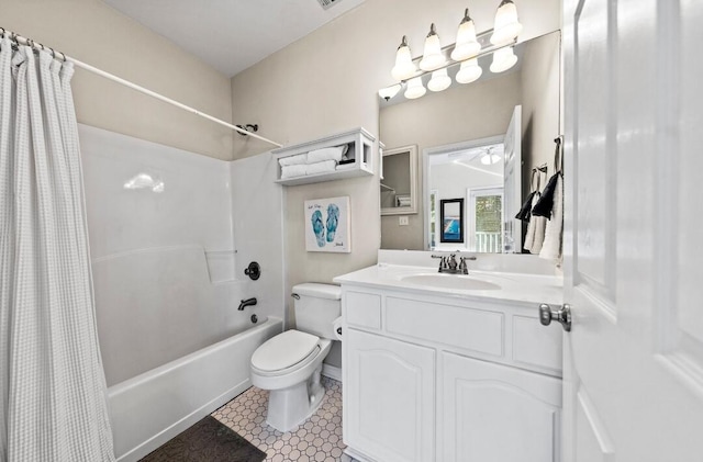 bathroom with shower / tub combo with curtain, toilet, and vanity
