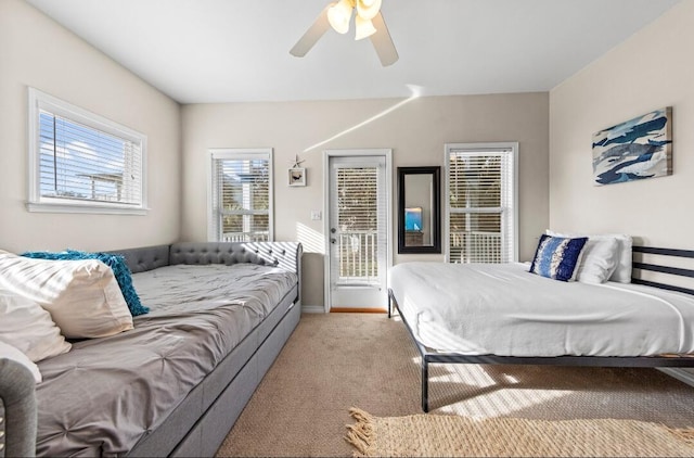carpeted bedroom with baseboards, access to outside, and ceiling fan