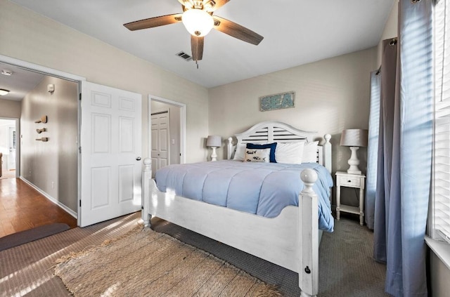 bedroom featuring visible vents and ceiling fan