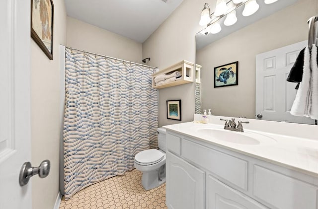 bathroom featuring toilet, vanity, and a shower with shower curtain