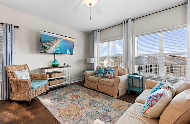 living area with wood finished floors and ceiling fan