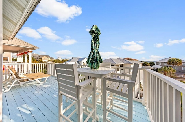 wooden terrace with a residential view