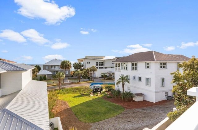 exterior space featuring a residential view and central AC unit