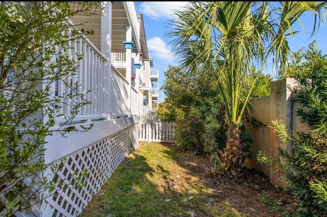 view of yard with stairway and fence