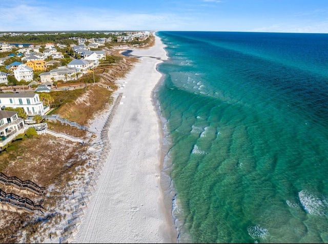 bird's eye view featuring a beach view and a water view