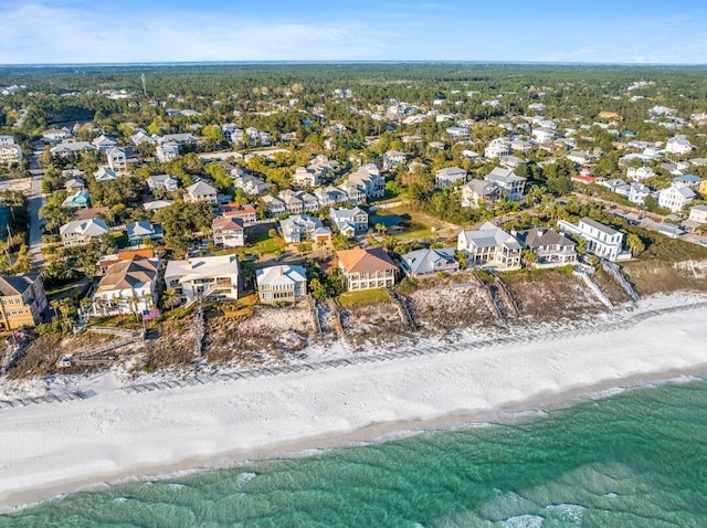 bird's eye view featuring a residential view, a view of the beach, and a water view