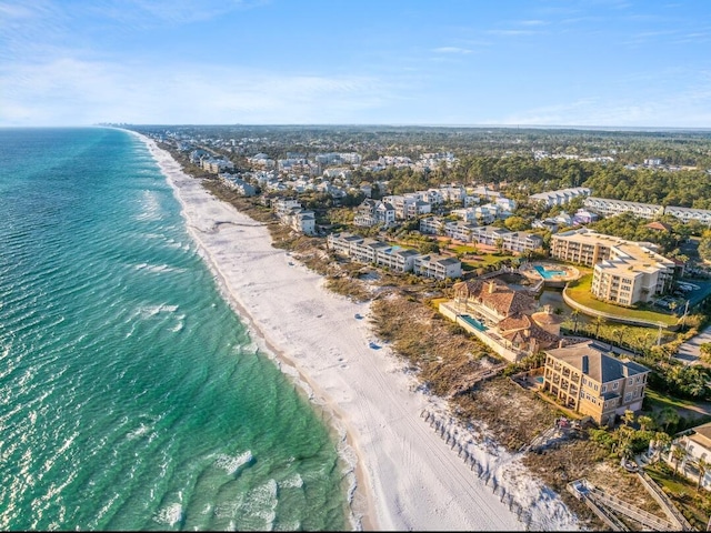 bird's eye view featuring a view of the beach and a water view