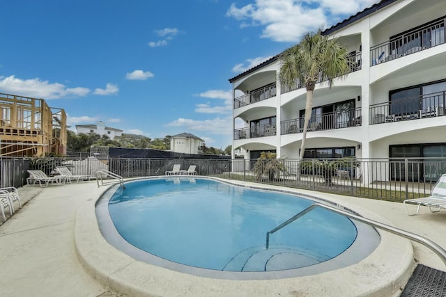 community pool featuring fence