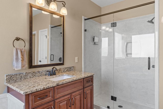 full bath with vanity and a stall shower