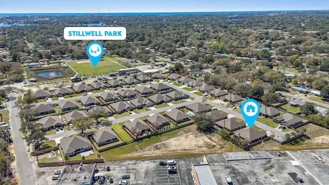 birds eye view of property with a residential view