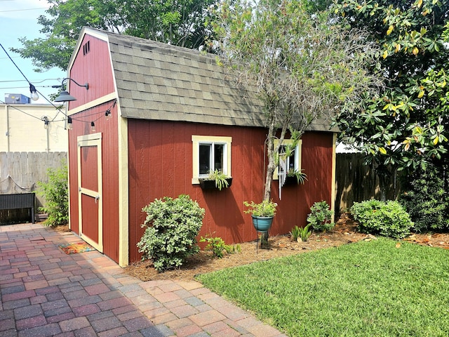 view of shed with fence