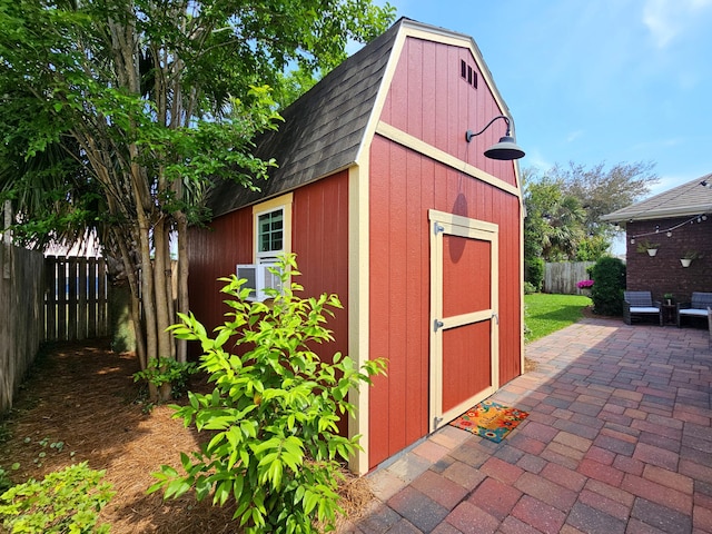 view of shed with a fenced backyard
