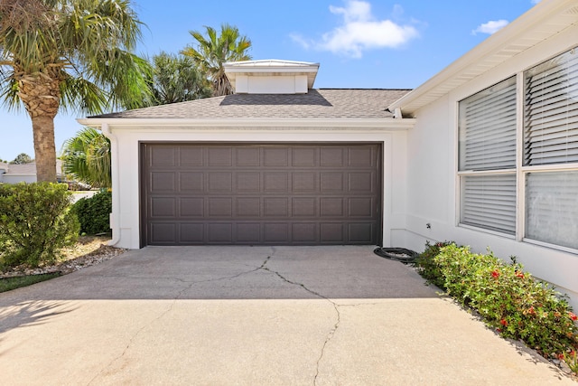 garage featuring driveway