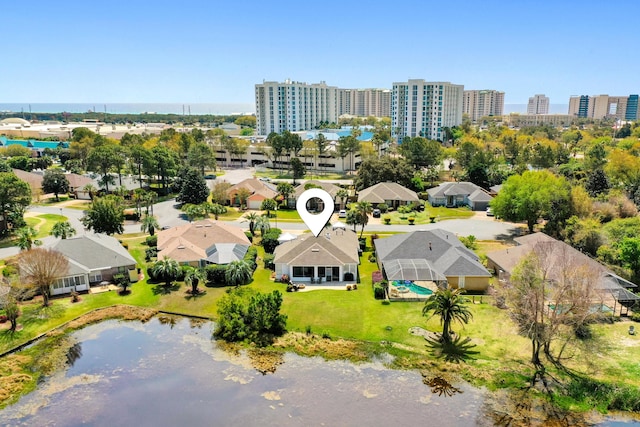 drone / aerial view with a water view and a city view