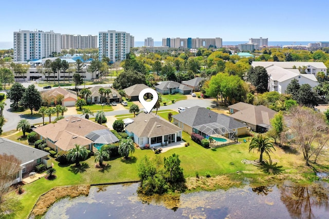 birds eye view of property with a water view, a city view, and a residential view