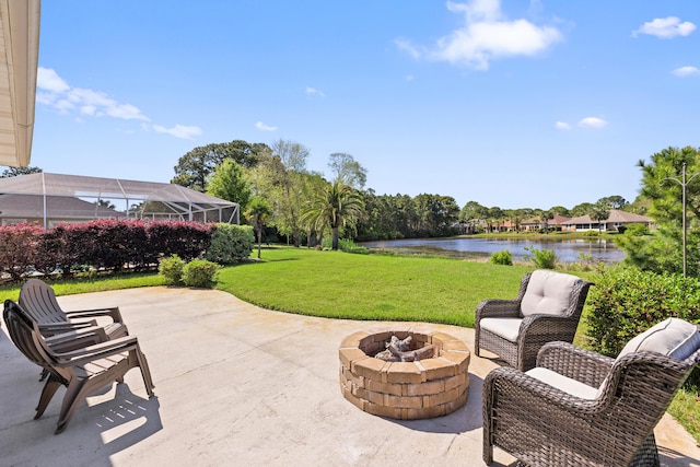 view of patio / terrace featuring a water view and a fire pit