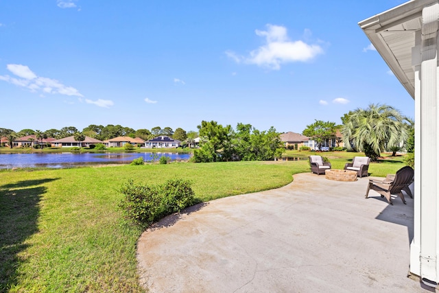 view of patio / terrace with a water view and a residential view