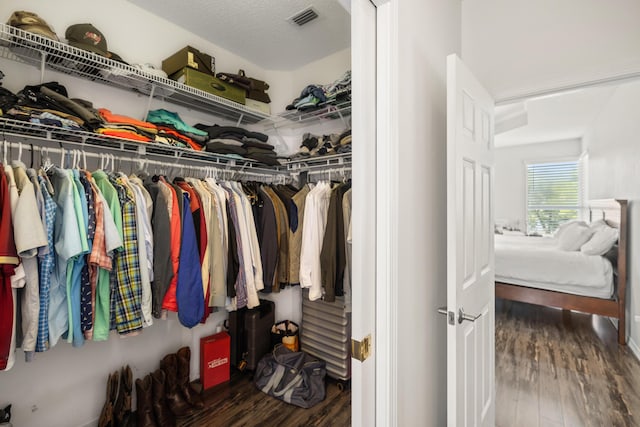 spacious closet with visible vents and wood finished floors