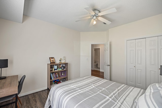 bedroom featuring a closet, baseboards, a textured ceiling, dark wood-type flooring, and ceiling fan