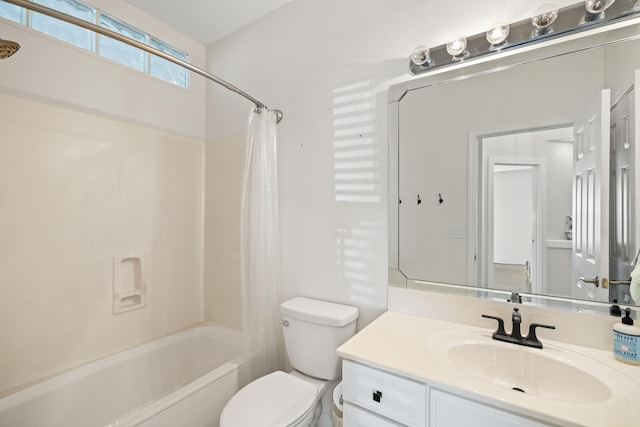 full bathroom with vanity, shower / bath combination with curtain, and toilet