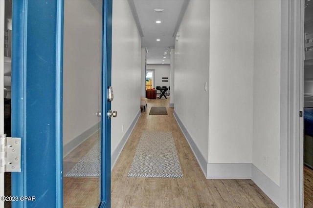 8320 Surf Dr, Panama City Beach, FL 32408 - corridor featuring recessed lighting, baseboards, and wood finished floors