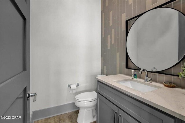 8320 Surf Dr, Panama City Beach, FL 32408 - half bath with vanity, toilet, and baseboards