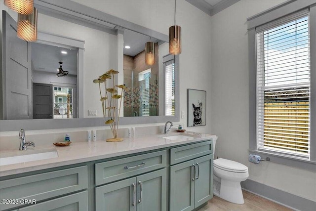 8320 Surf Dr, Panama City Beach, FL 32408 - full bath with double vanity, toilet, a stall shower, and a sink