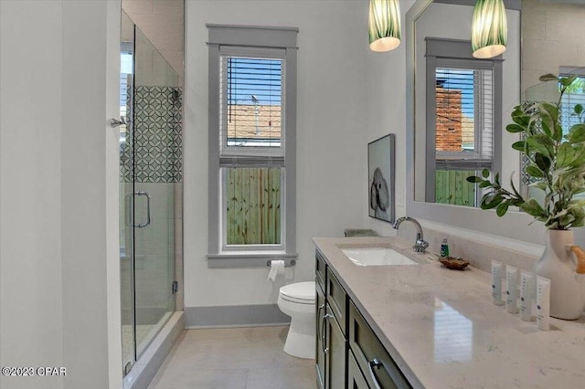 8320 Surf Dr, Panama City Beach, FL 32408 - full bathroom with vanity, toilet, a stall shower, and plenty of natural light