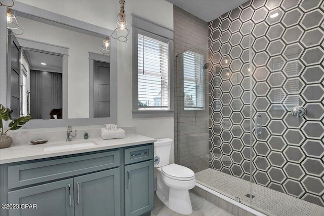 8320 Surf Dr, Panama City Beach, FL 32408 - bathroom featuring toilet, tiled shower, and vanity