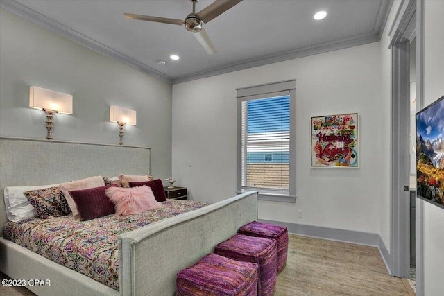 8320 Surf Dr, Panama City Beach, FL 32408 - bedroom with wood finished floors, a ceiling fan, baseboards, and ornamental molding