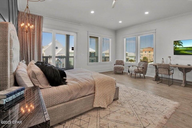 8320 Surf Dr, Panama City Beach, FL 32408 - bedroom featuring light wood-type flooring, baseboards, ornamental molding, and access to exterior