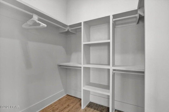 8320 Surf Dr, Panama City Beach, FL 32408 - spacious closet featuring wood finished floors